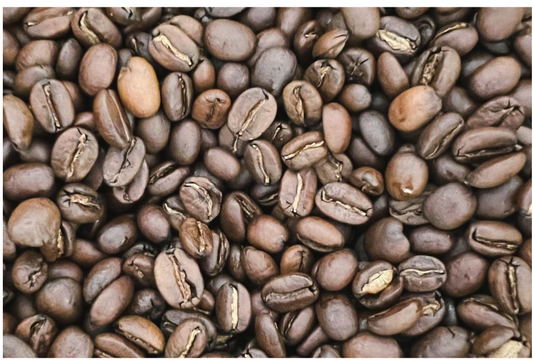 A close-up of arabica coffee beans, showcasing their rich texture and deep brown color.